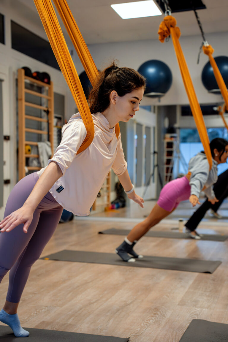 What That Pressure in Aerial Yoga Means for Your Body