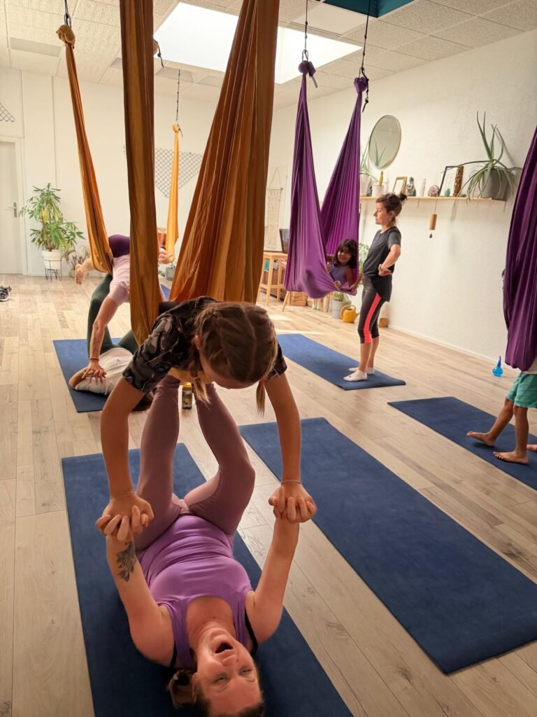 Hang Together: How Aerial Yoga Can Bring Friends, Couples and Families Closer